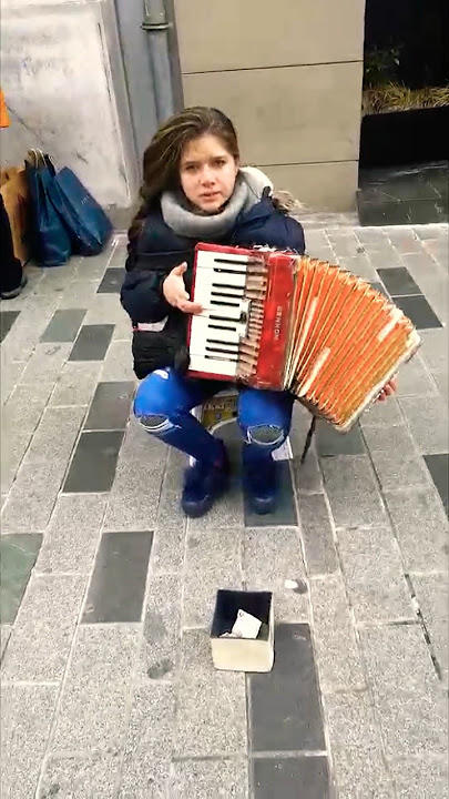 A little girl playing the accordion in Istanbul