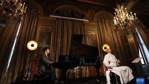 郎朗与果敢演奏"花木兰"在巴黎《郎朗的迪士尼》专辑发布会.Lang Lang and Guo Gan - "  Mulan "  in Paris .