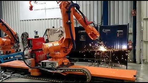 ABB arc welding industrial robot 6640 on a linear track at Eurobots