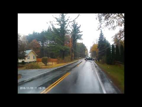 Woman Knocks Over Trash Can With Car