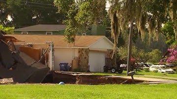 Part of home falls into house