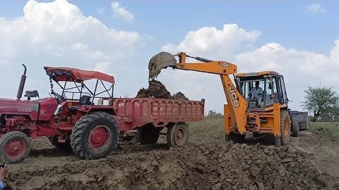 JCB 3DX Backhoe loading mud in Mahindra 415 Di Fe NEW Holland For Jcb khudai video