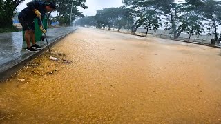 Working In Raining Unclogging Drain Storm Flood Street