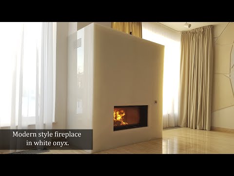 Modern style fireplace in white onyx.