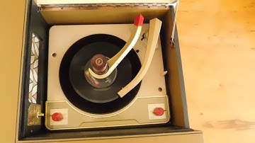 Voice of Music Hi-Fi consolette record player playing a couple 45