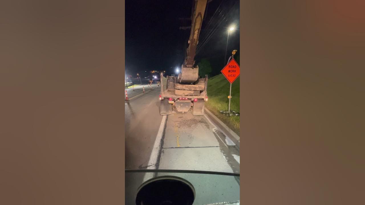 CAT 318D Excavator. Pulling concrete slabs, backwards bucket. cat 