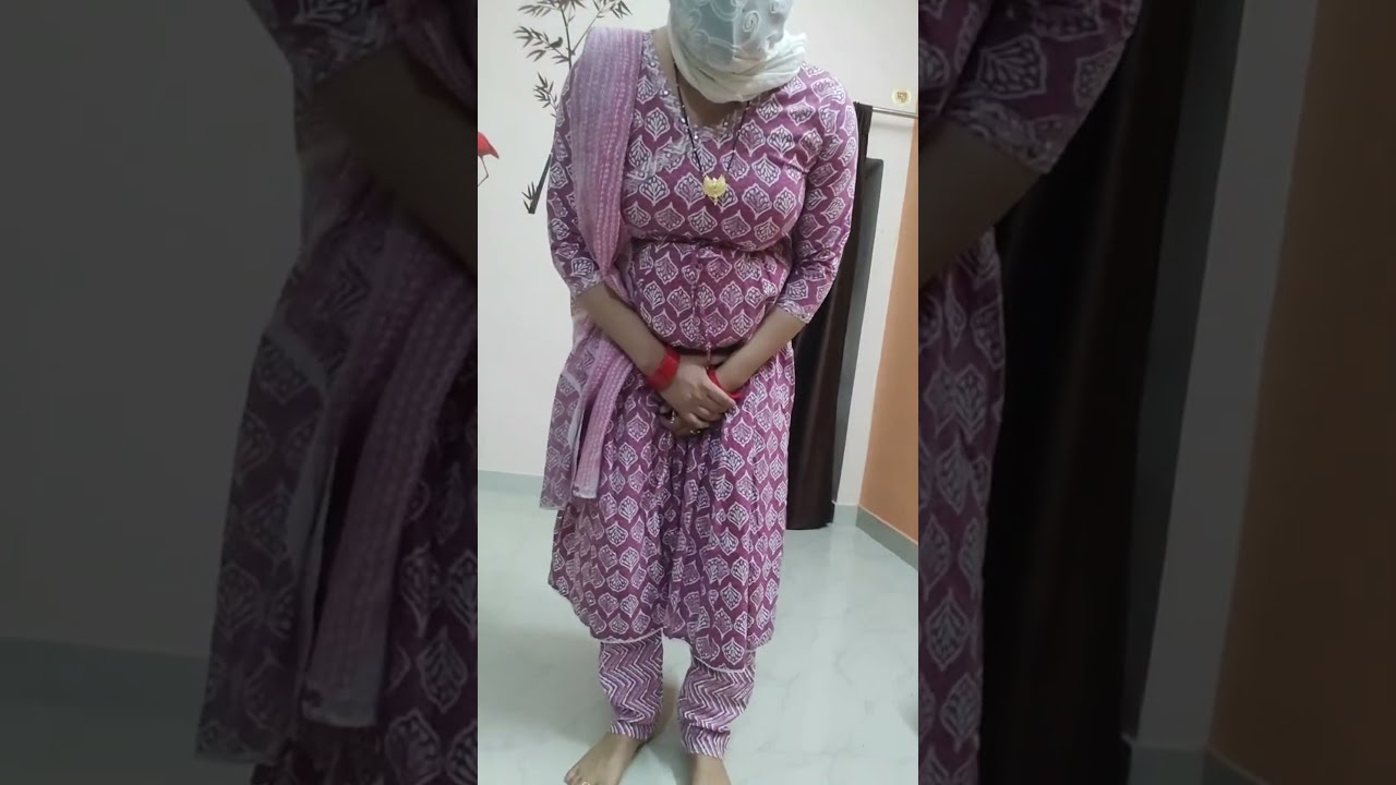 Crossdressing video in beautiful dress.