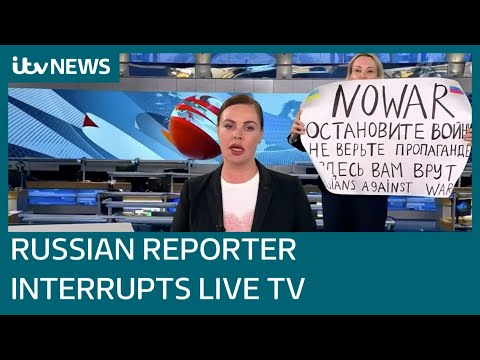 Russian journalist interrupts live TV state media broadcast with 'no war' protest | ITV News