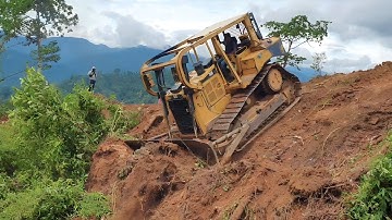 The Operator of the CAT D6R XL Bulldozer Works Perfectly to Clear Land for Plantations