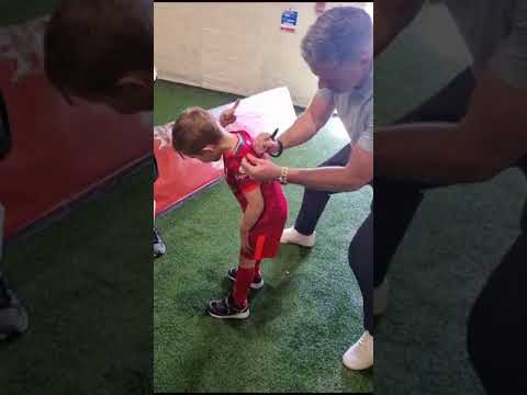 Jamie signs an LFC shirt for Josh