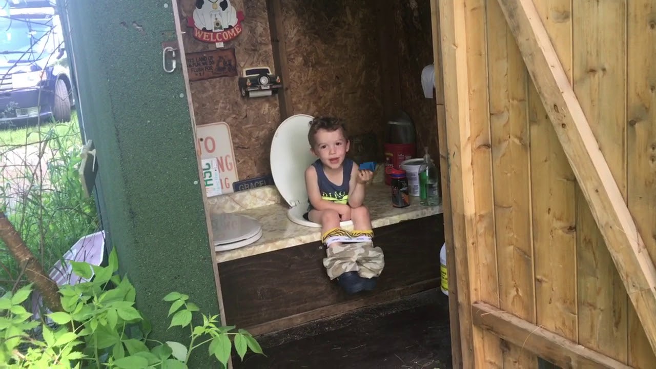 Little boy’s first outhouse experience.