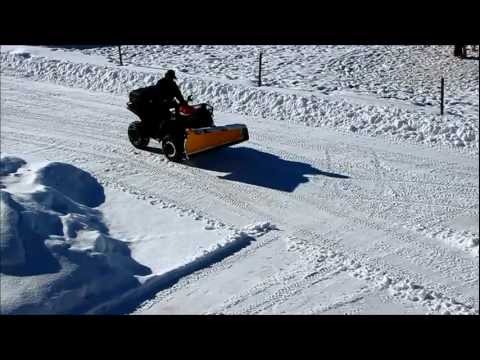 arctic-cat-400-plowing-snow
