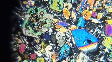 a crudely edited video of volcanic rocks seen under a microscope