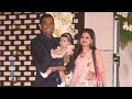 Spotted dhoni with wife sakshi and new born baby at harbhajan singh  rohit sharmas reception