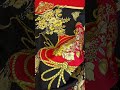 Шелковый купон от бренда Gucci в элегантном сочетании оттенков - черного, золотого и красного