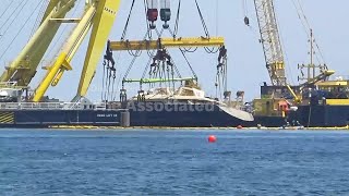 Luxury superyacht is partially resurfaced 10 months after sinking off Sicily