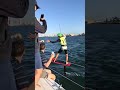 SAILOR hands BEER to KITEBOARDER!