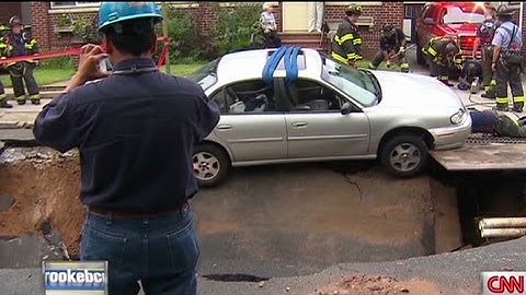 Sinkhole almost swallows a car in Brooklyn.