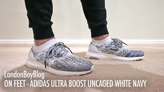 white ultra boost uncaged on foot