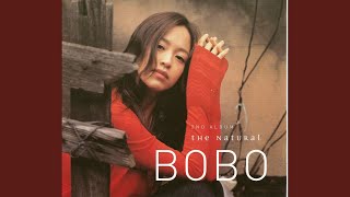 Under an umbrella in autumn rain