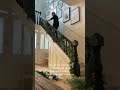 Leoma Harper transforms her staircase by layering garlands and decorations. #garlands #staircase