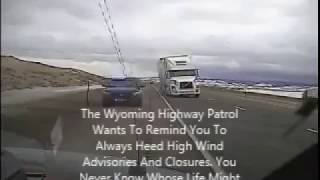 Wyoming wind gust blows semi truck on top of police car