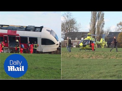 Train derailed in Holland after colliding with a milk truck - Daily Mail