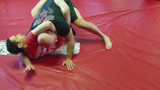 Escaping a Guillotine Choke from Guard (Jiu Jitsu)