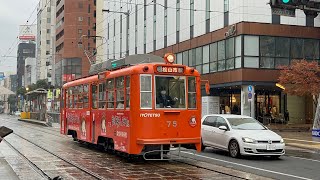 伊予鉄道モハ50形75 ジブリ電車　大街道電停発車