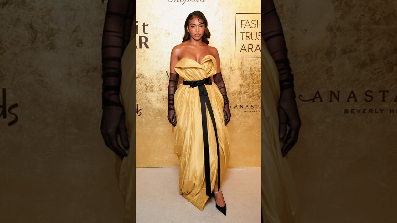 lori harvey gold dress Lori Harvey in Thigh-High Slit Dress Has Fans Saying 'Damn Girl'