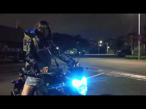 Cute chick revving her bike