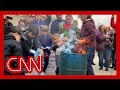 Children burn masks at rally