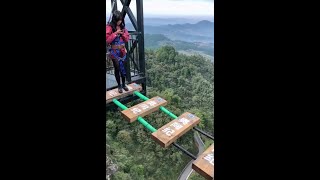 Chinese tourist unfastens mid-jump on high-altitude bridge