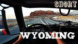 Early spring drive on I 80 at Utah-Wyoming border. POV Volvo VNL 860. Short.