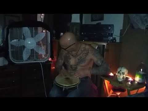 Brian Blue playing his bongo drum.