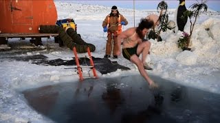 Antarctic researchers take icy plunge to mark solstice