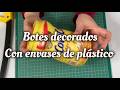 Dos botes decorados con envases de plástico