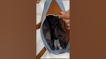 dán nẹp kéo miệng túi xách trước khi may miệng túi xách màu xanh