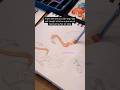 Sketchbook artist paints a flamingo with gouache