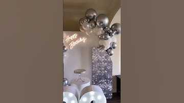 Silver Party Decor With Balloons And Shimmer Wall