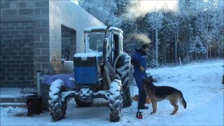 Starting an air cooled tractor in winter. Featuring T-40AM Russian tractor