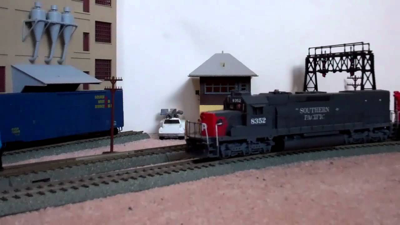 A Metra Commuter Train Meets A Southern Pacific Mixed Freight In HO