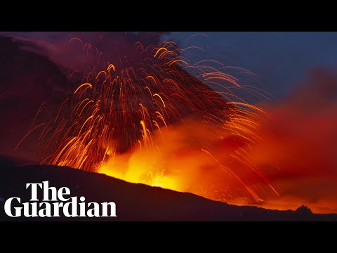 Mount Etna lights Sicily's night sky with red hot lava