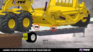 Loading K-Tec Scraper on Flat Deck Trailer