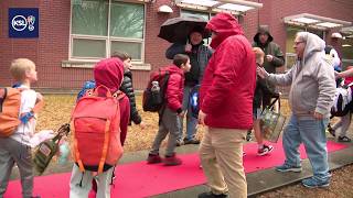 Millcreek elementary students get red carpet welcome from local dads