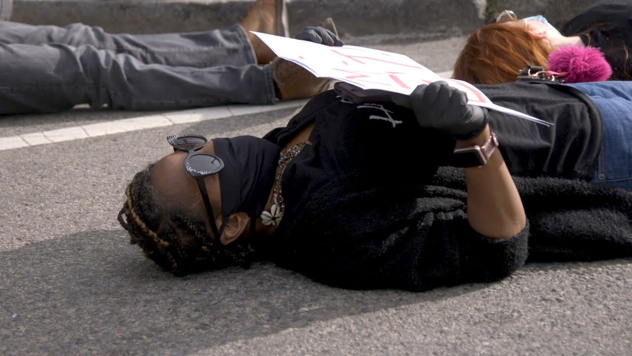 Protesters stage a die in to protest the death of George Floyd