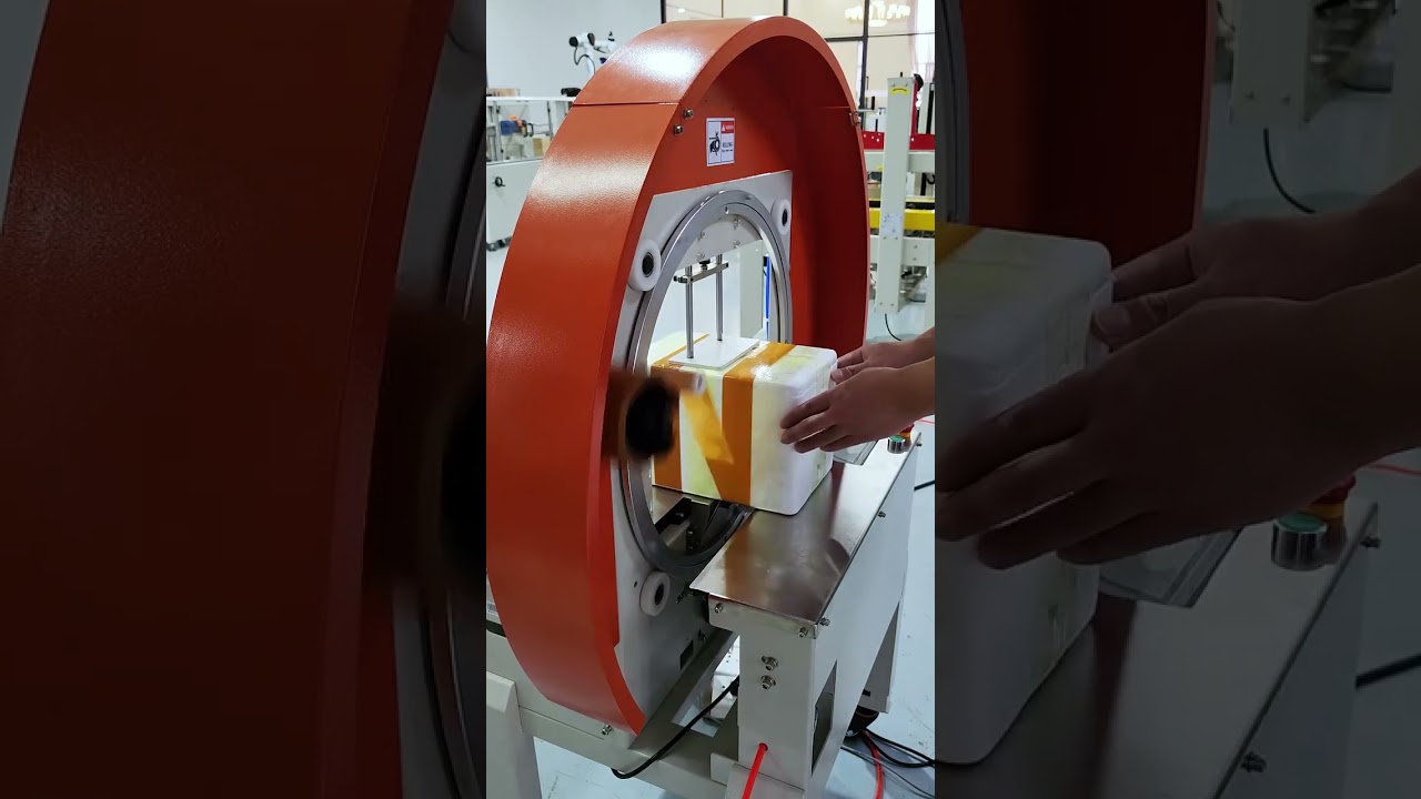 This automatic tape wrapping and sealing machine can achieve full-circle intelligent..
