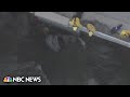 Rescue crews save driver from car 300 feet below bridge