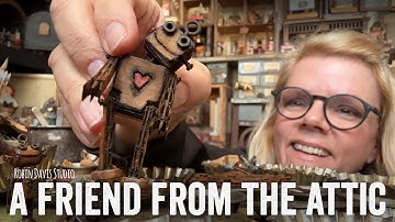 A friend from the Attic - Pocket makes a tiny cardboard robot.