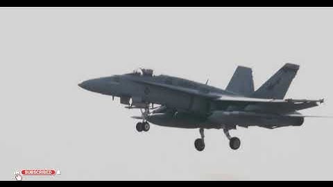 U.S. Marine Corps F/A-18A Hornet aircrafts with Marine Fighter Attack Squadron (VMFA) 112 fly above